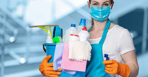 Cleaning lady with tools and mask