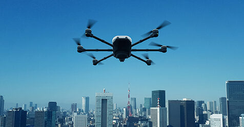 Drone flying above city skyscrapers