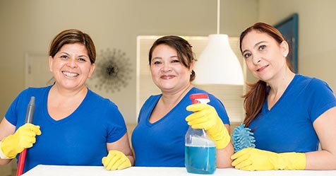 Hispanic female cleaning pros