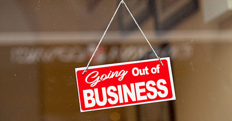 Going out of business sign in window