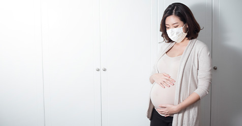 pregnant woman with face mask