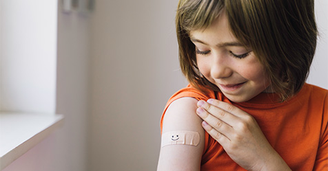 young girl getting a vaccine