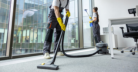 janitors cleaning in office