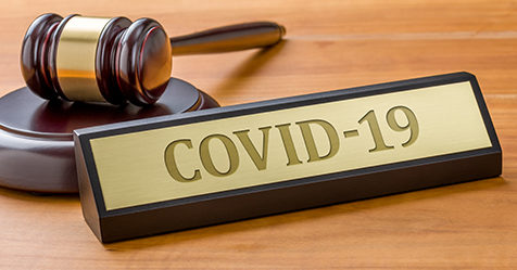 gavel next to COVID-19 sign