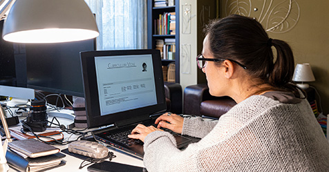 woman looking at a laptop